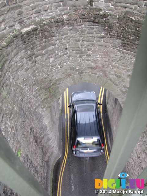 SX23431 Carr passing underneath medieval wall